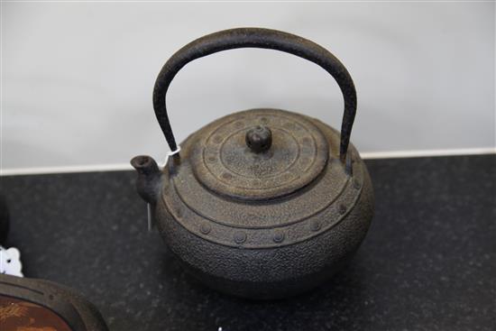 Five Japanese cast iron teapots, two with lacquer covers, 19th century, largest 19cm wide